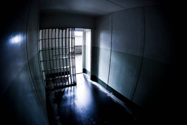 Dark Prison Cell, Open Gate Open prison cell in Alcatraz, San Francisco. Grainy due to high iso level. fish eye effect stock pictures, royalty-free photos & images