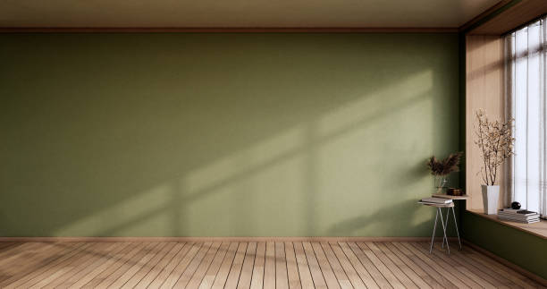 istock Empty room - green wall on wood floor interior and decorations plants. 3D rendering 1350637831