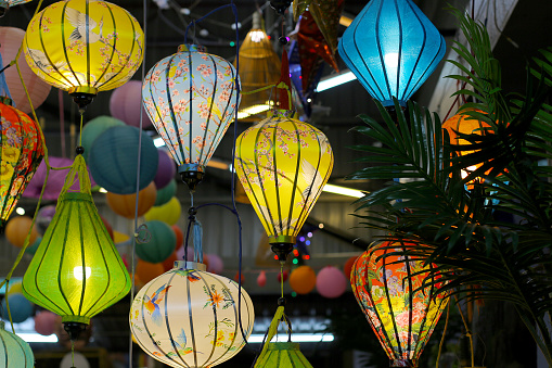 Multi-coloured Vietnamese inspired lanterns hanging for decoration.