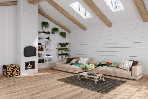 Modern Attic Living Room With Beige Corner Sofa, Coffee Table, Fireplace And Hanging Baskets