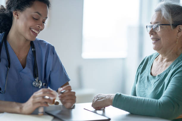 istock Nurse Reviewing how to Safely Take a Patients Medication 1350643536