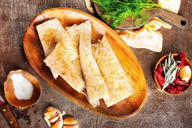 Fish fillet on a woodentray. white fish prepare for cooking