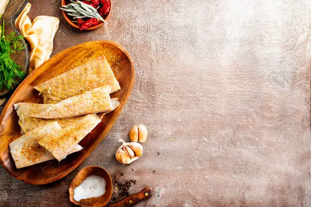 Fish fillet on a woodentray. white fish prepare for cooking