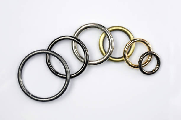 istock Large and small metal rings on a white background. 1350643839