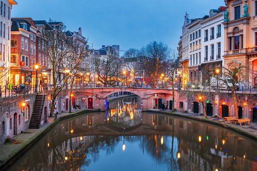 Utrecht, Netherlands canals and cityscape at twilight.