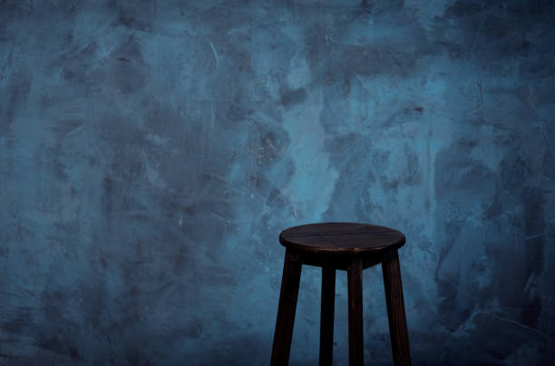 istock chair in dark loft interior. 1350645035