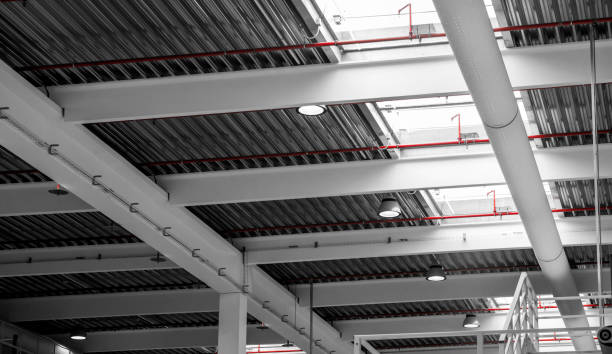 istock industrial building interior - roof structure view from below 1350645721