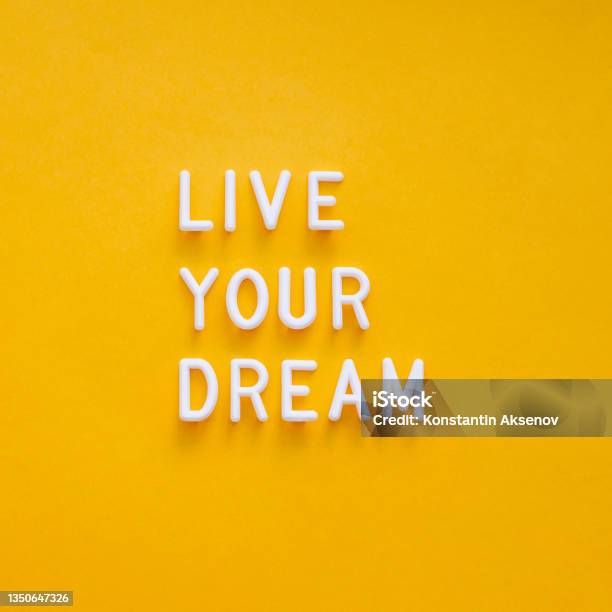 Live Your Dream Motivating And Inspiring Phrase On Bright Yellow Background Top View On Lifting Spirit Message Creative Rise Stock Photo - Download Image Now