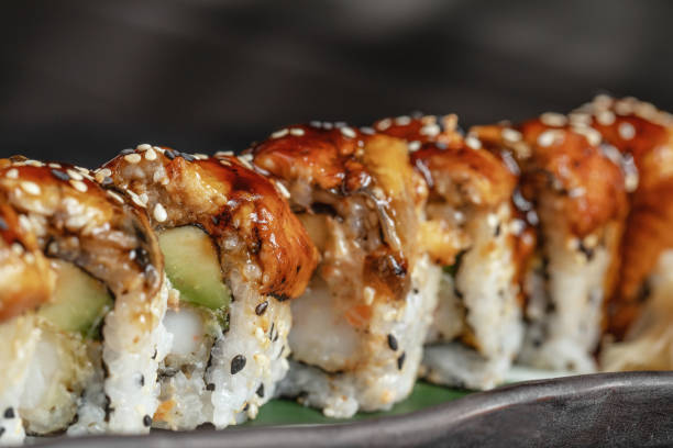 istock Sushi Rolls Set with Eel on Plate macro Close Up. 1350649201