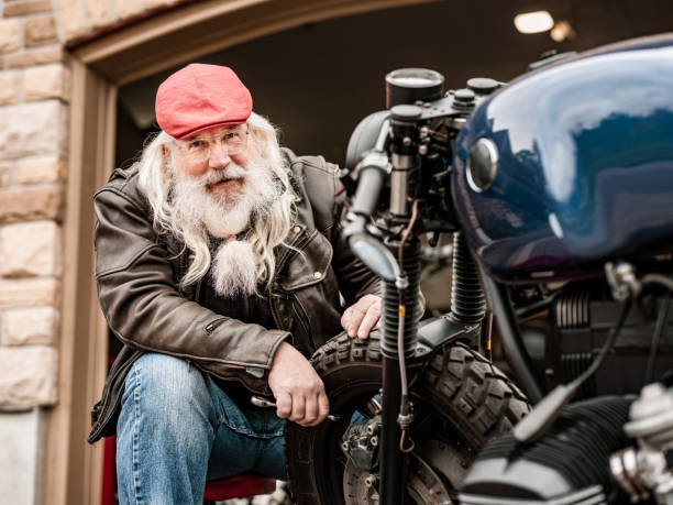 istock Senior man working on his racing motorcycle 1350649262