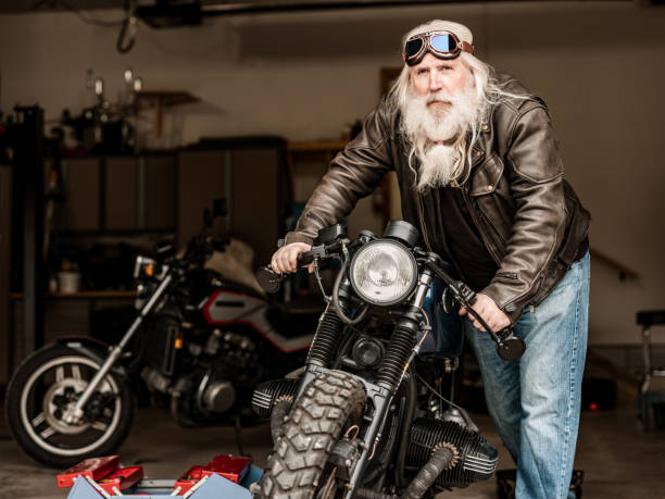 istock Senior man working on his racing motorcycle 1350649284