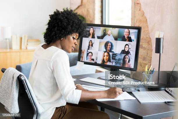 Mid Adult Female Ceo Takes Notes During Employee Engagement Meeting Stock Photo - Download Image Now