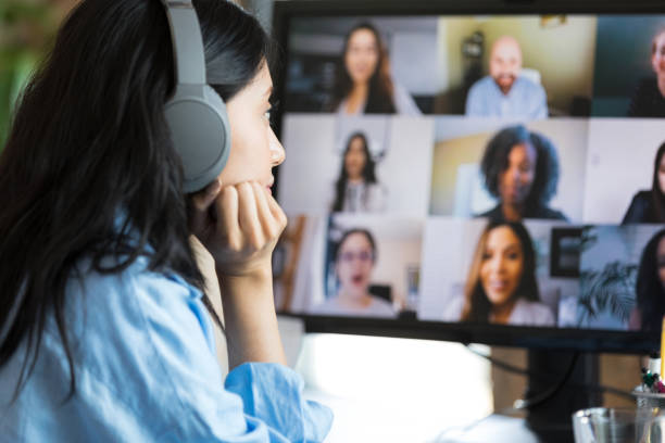 istock Bored female college student sits in front of computer screen 1350649463