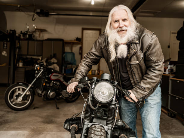 istock Senior man working on his racing motorcycle 1350649585