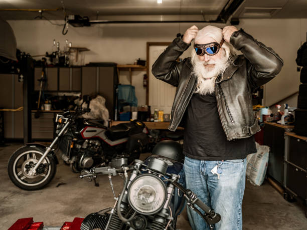 istock Senior man getting ready to ride his motorcycle 1350649664