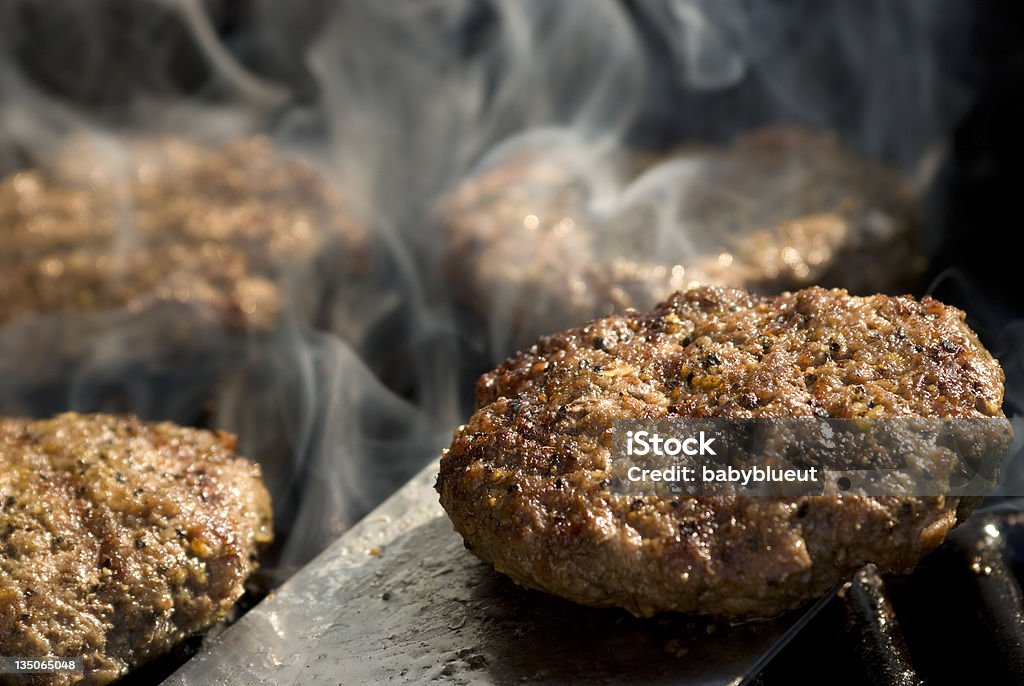 Hamburgers on the barbecue grilling hamburgers on the barbecue Barbecue - Meal Stock Photo