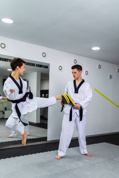 istock Disabled woman training taekwondo with her coach. 1350650912