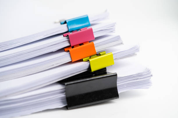 istock Stack of report paper files in business office clips. 1350650938