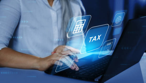 business woman using a laptop with digital graphic screen to complete income tax form online. financial research,government taxes and calculation tax return concept. tax time - tax tax form law business imagens e fotografias de stock