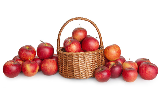 Red apples in a basket on a white background