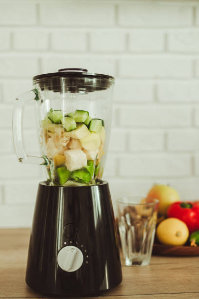 stationary blender with ingredients for healthy smoothie on table in kitchen. - blender apple banana color image imagens e fotografias de stock