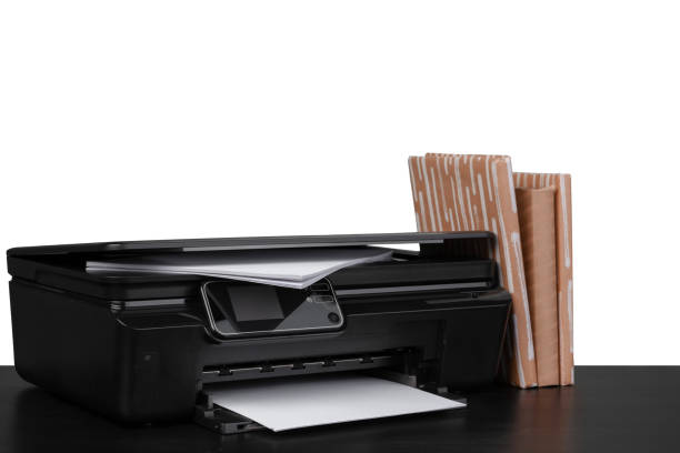 istock Office table with laser printer and books against white background 1350659494