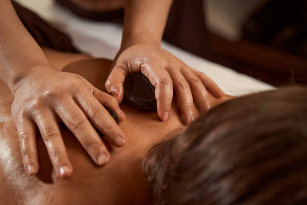 istock Therapist relaxing patient back muscles during massage therapy session 1350660485
