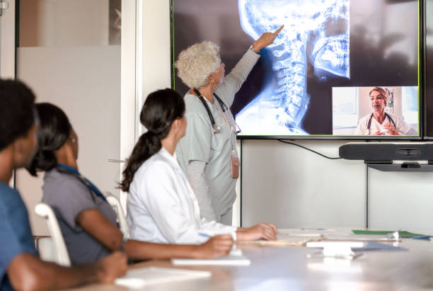 istock Medical Team Reviewing Scans 1350662040