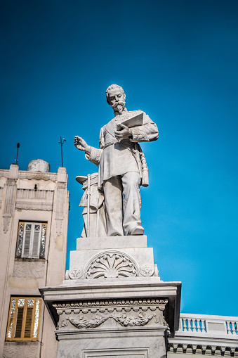 Porto, Portugal - July 6, 2022: A bronze statue of King D. Pedro V (circa 1924) by Antonio Teixeira Lopes (1866-1942) on Praça da Batalha.