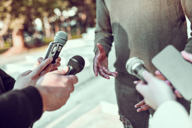 African Male Giving Statement To Journalists Outside