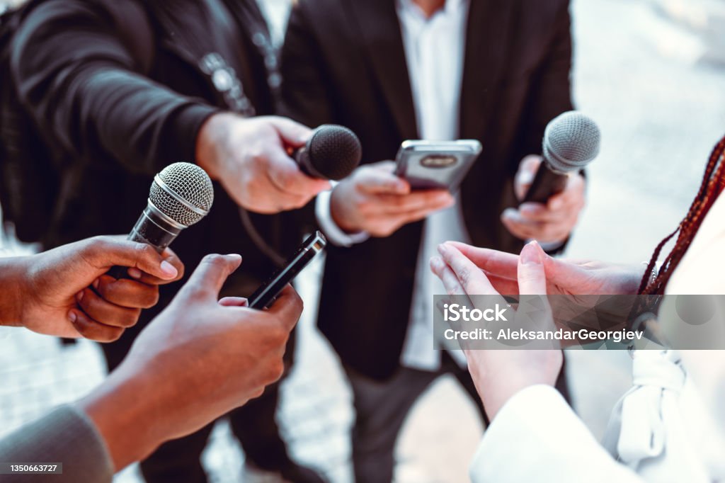 Female Leading Interview With Journalists Outside Journalist Stock Photo