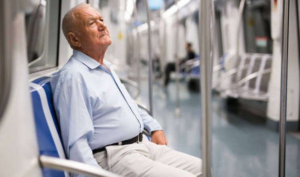 istock Senior man in metro train 1350665157