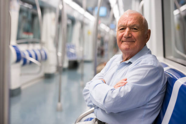 istock Senior man in metro train 1350665158