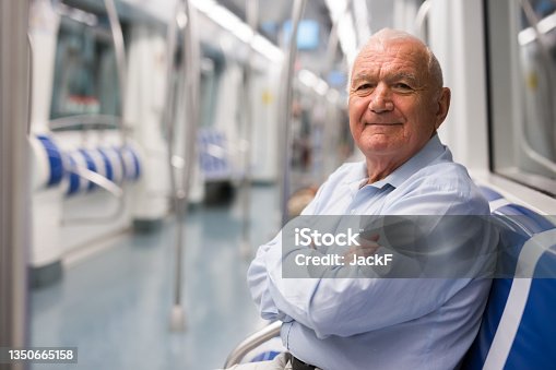 istock Senior man in metro train 1350665158