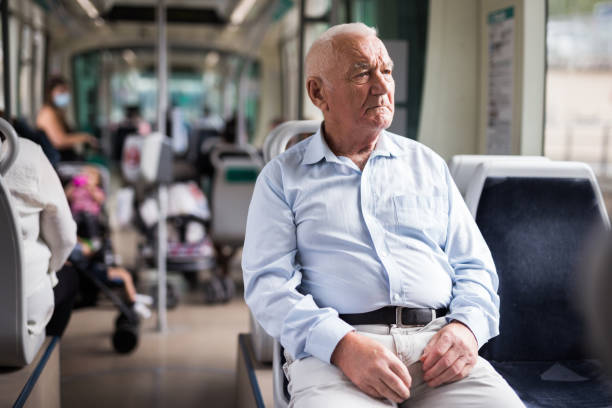 istock Old man in streetcar 1350665213