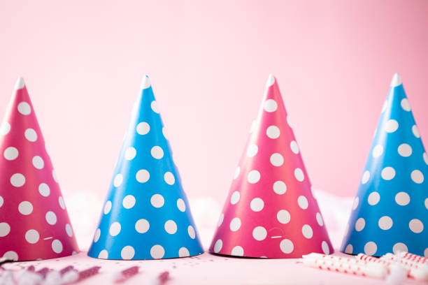 Pink happy birthday paper polka dots hat background stock photo