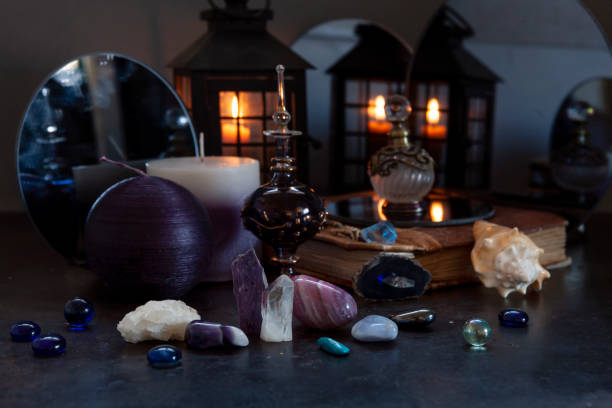 istock Many different gemstones on the blurred mirrors and  candles background. 1350669548