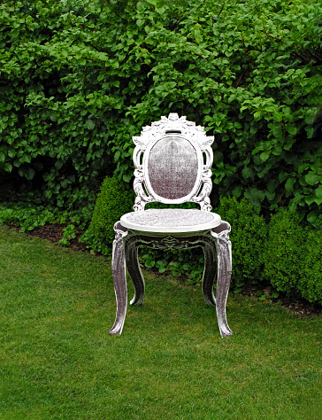 Antique old chair in the garden.