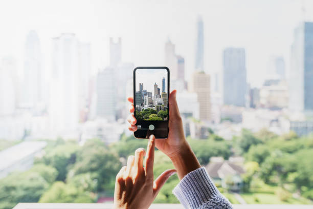 istock taking photography with phone 1350669732