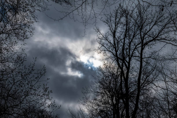 istock view of the sun behind the gray clouds 1350670214