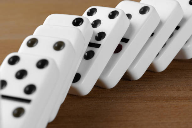 istock White domino dice on a wooden table 1350670882