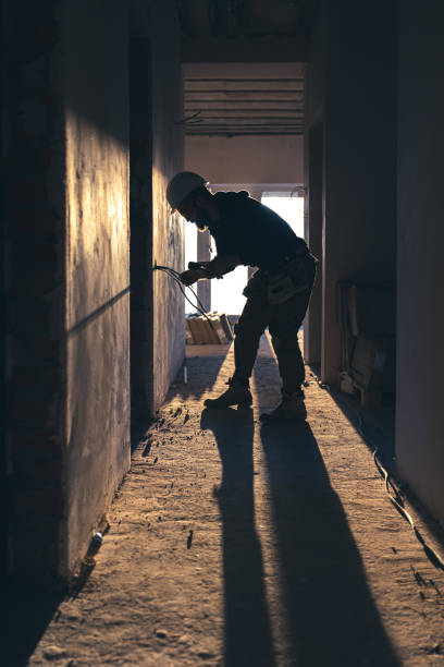 istock Worker is cutting wires with lineman's pliers. 1350671025
