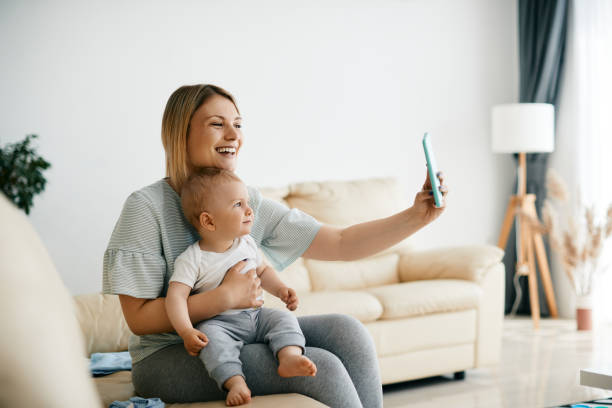 istock Happy mother taking selfie with her small son at home. 1350671272