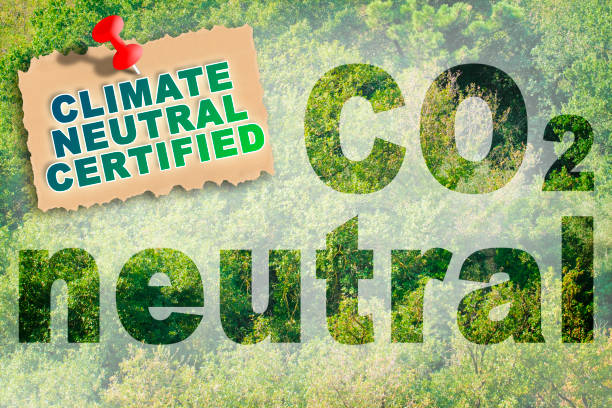istock CO2 Neutral concept against a forest backgound with label and Climate Neutral Certified text 1350672863