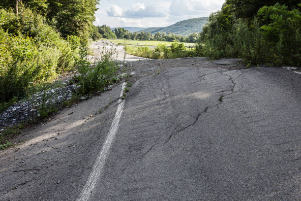 istock Destroyed road consequences of a natural cataclysm 1350673890