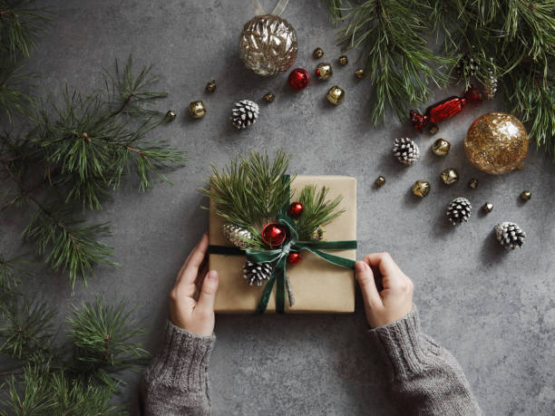 Woman decorating Christmas present