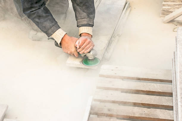 A man polishes a granite slab with a grinder. Work on stone with an angle grinder. A man polishes a granite slab with a grinder. Work on stone with an angle grinder. A worker polishes a white stone. n11 stock pictures, royalty-free photos & images