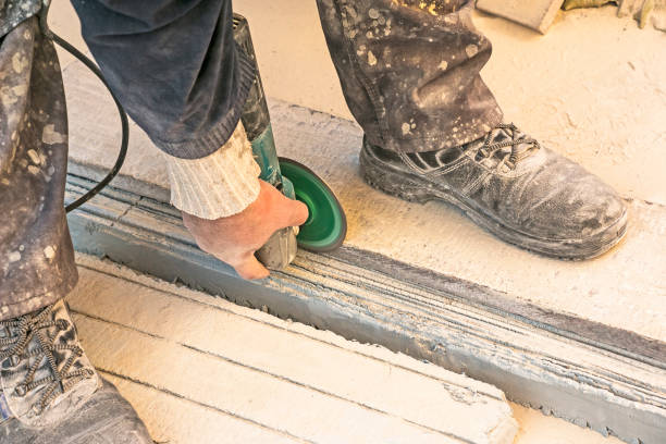 istock A man polishes a granite slab with a grinder. Work on stone with an angle grinder. 1350675858