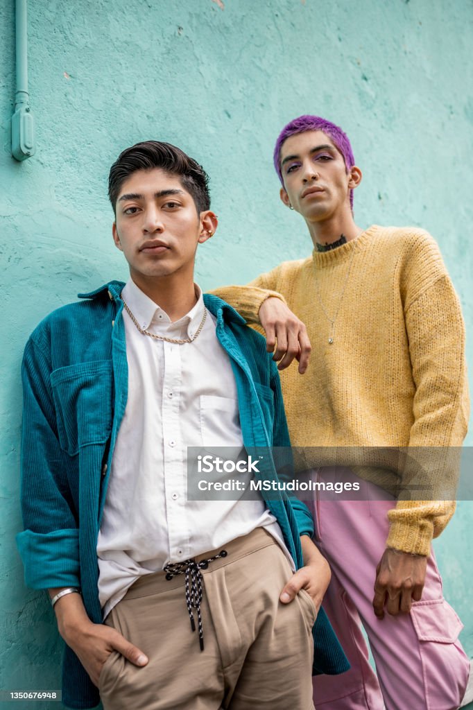 Low angle photo of two young man Low angle photo of two young man, they are leaning on the wall Fashion Stock Photo