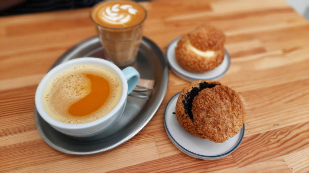 istock Tangerine tea, latte and cookies 1350677525